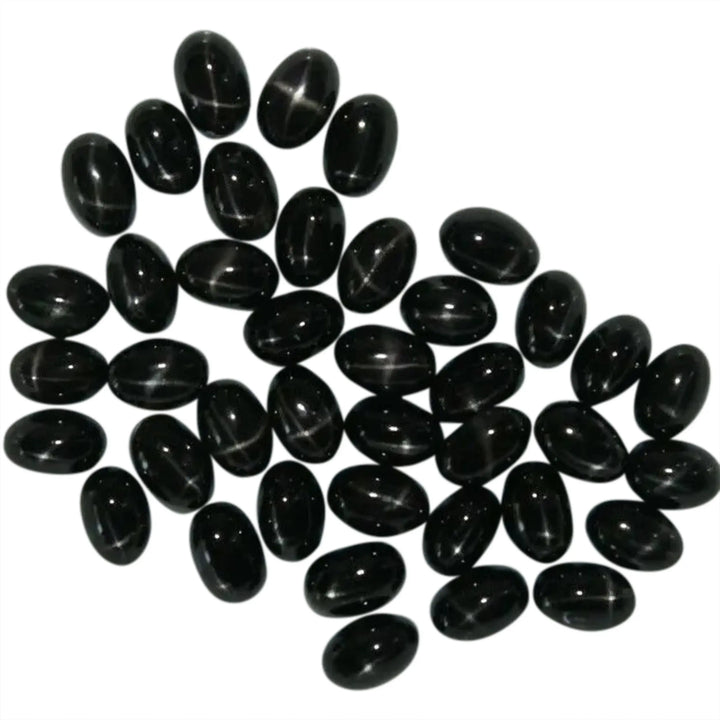 Cabochon, black star diopside, oval, 5x7mm, 1-10stk 