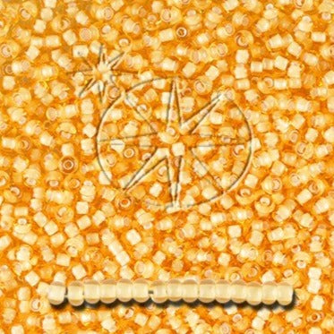 Orange glasperler, Preciosa seed beads. Transparente foret med kalkhvid.