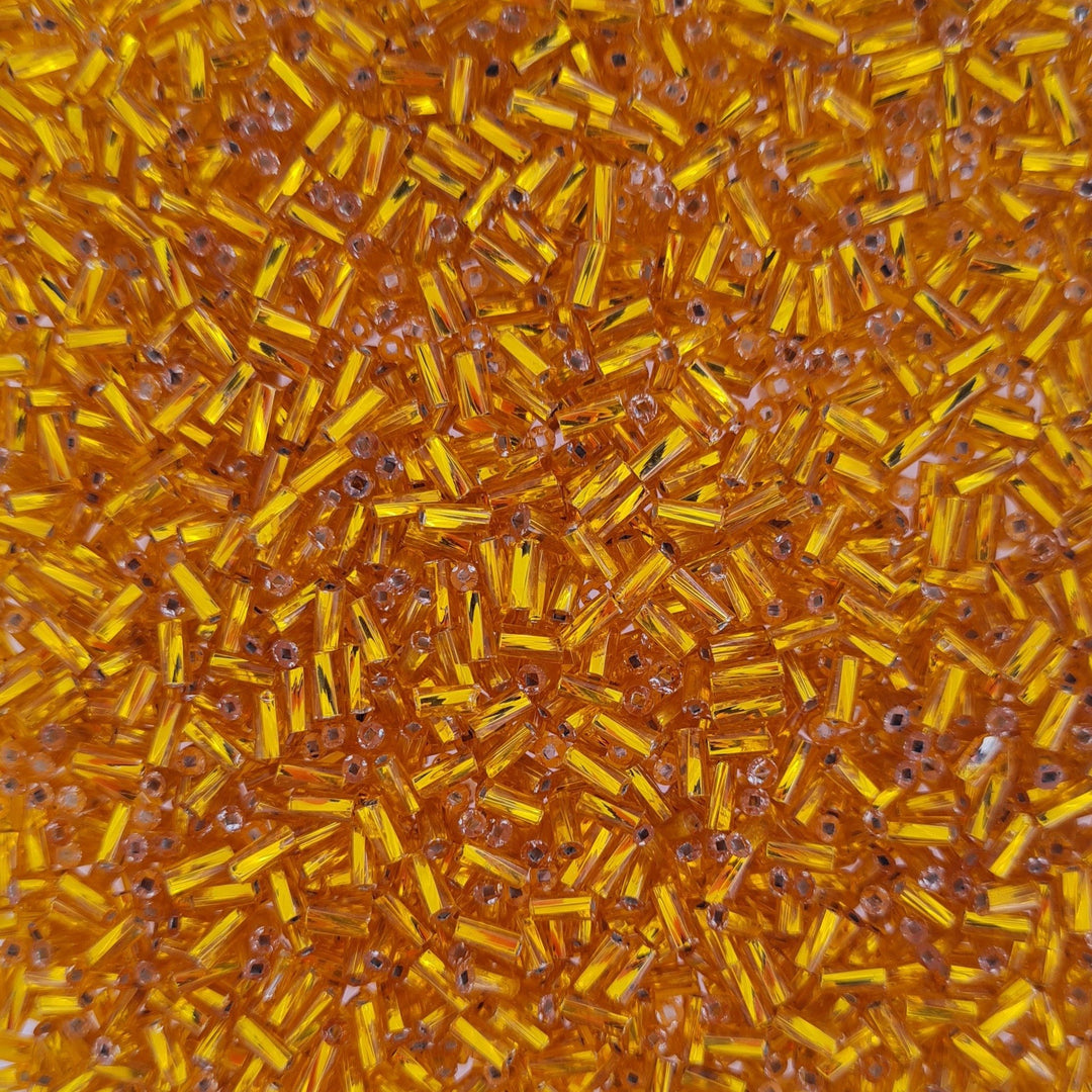 Orange Glasperler, twisted bugles, silverlined shiny amber, 5mm