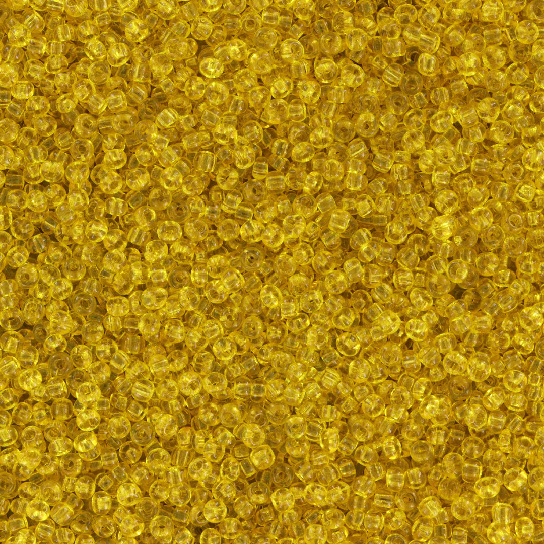 Gul Glasperle. Preciosa Seed Beads. Yellow Transparent